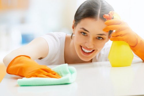 Inspecting curtains for dust and stains before cleaning